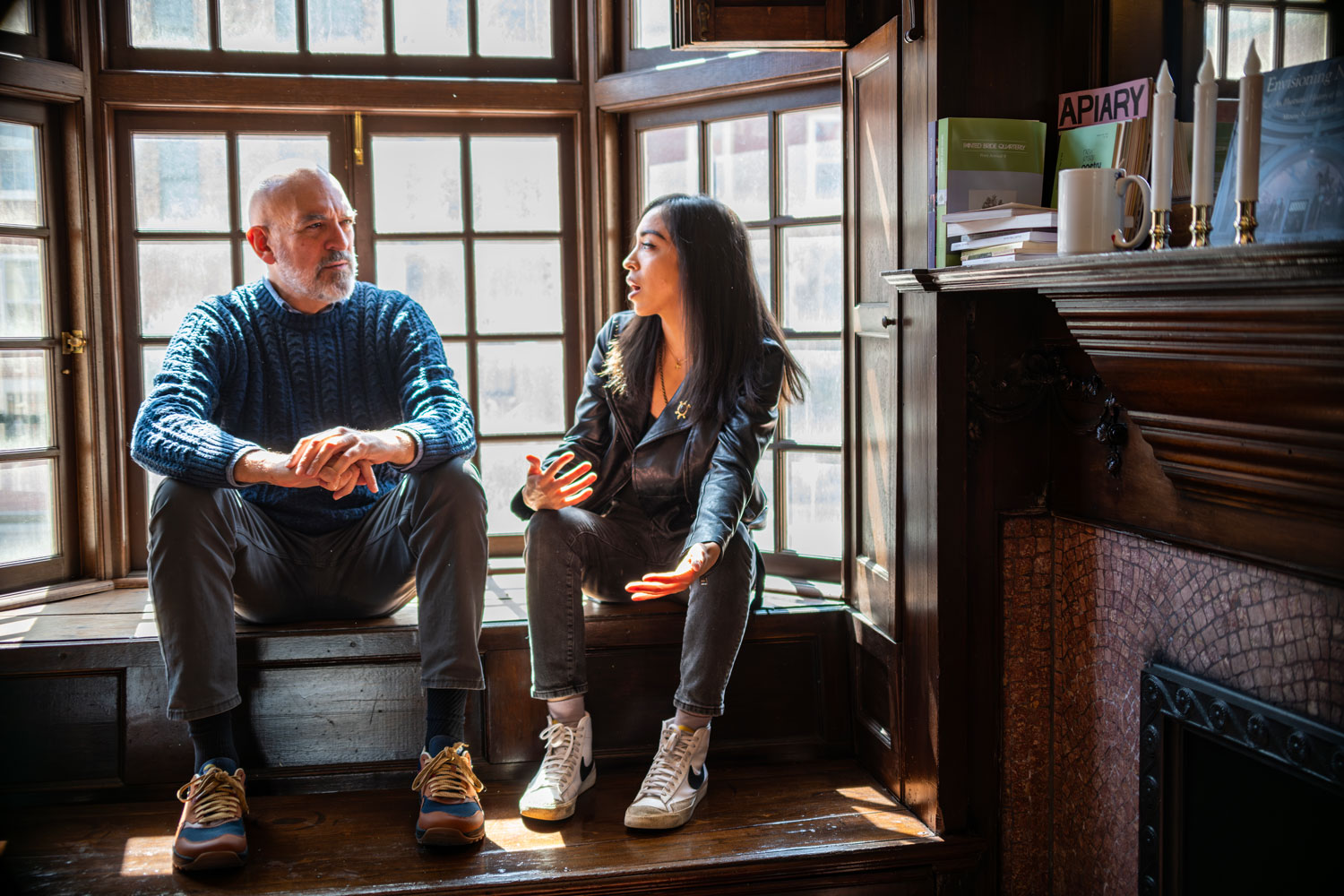 Paul with MFA student in front of a window