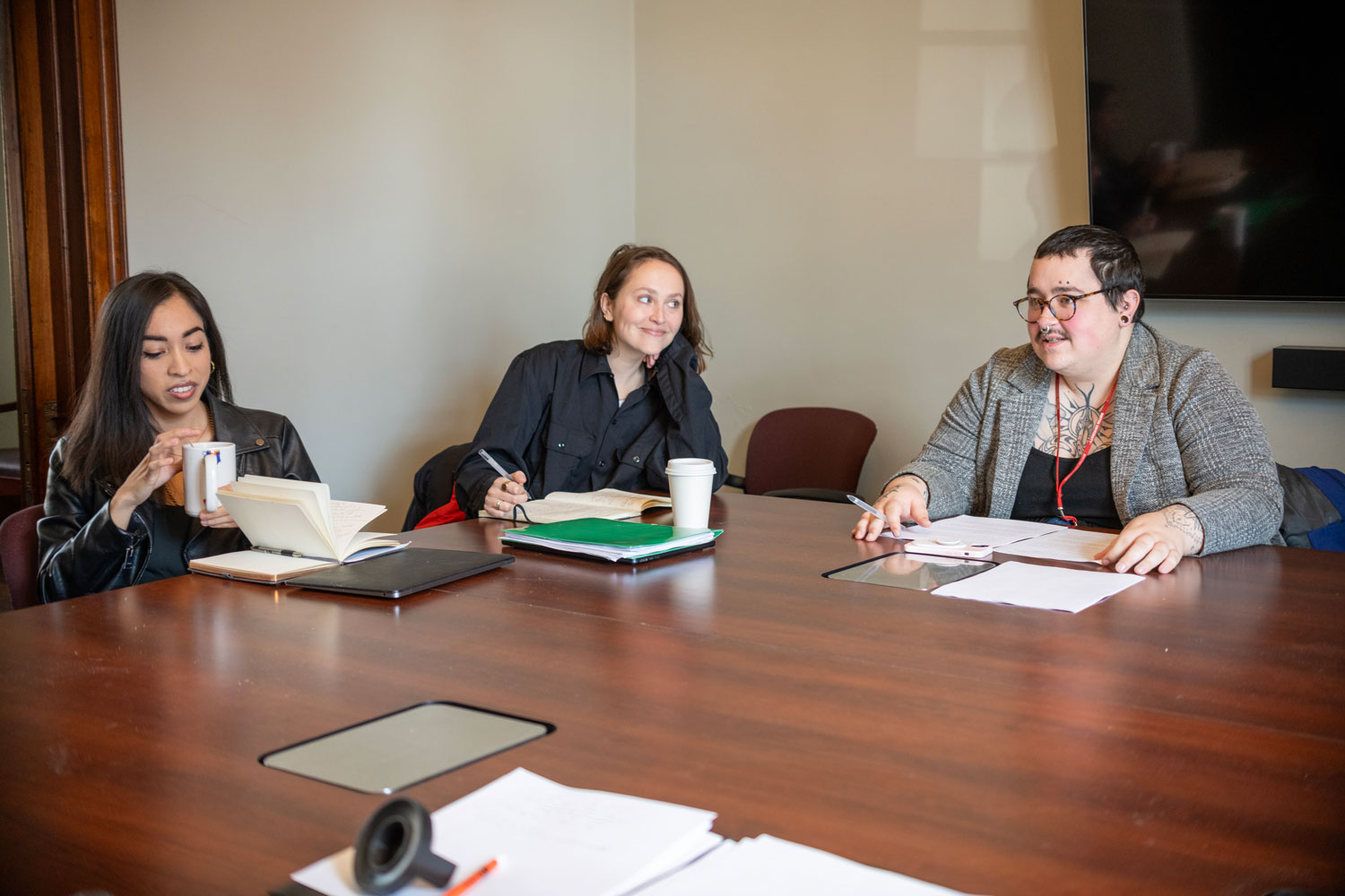 MFA Students discussion at table